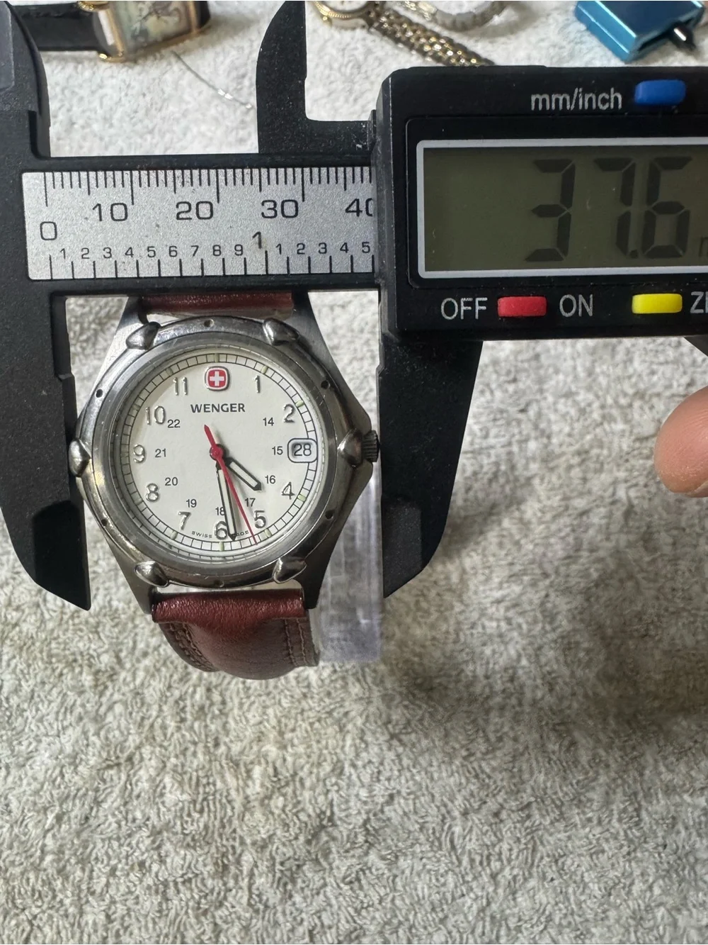 Wenger White Dial Watch with Brown Strap and Red Accent